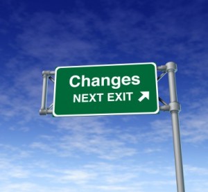 An exit sign on a highway that says Changes: Next Exit